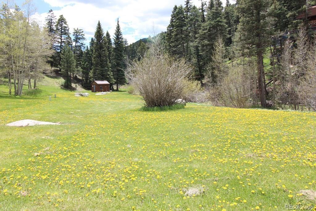 148 County Road 378, Unit 378 Rye, CO 81069 - Photo 24 of 35 a view of swimming pool with an outdoor space and seating area