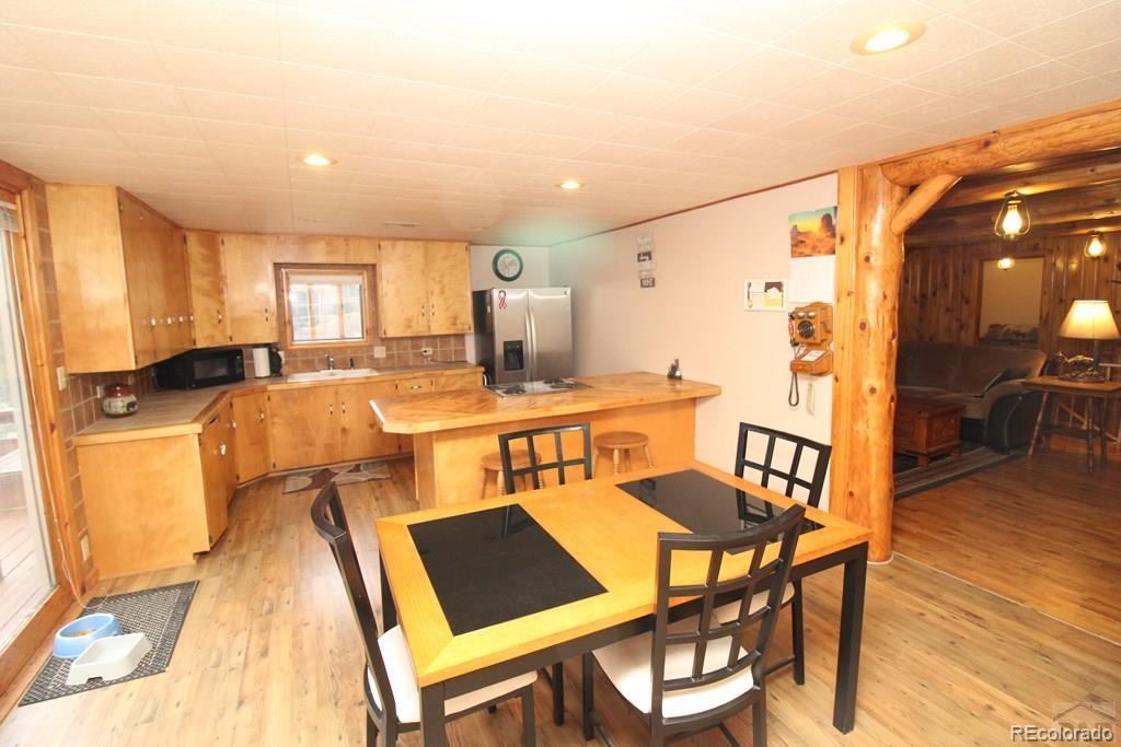 148 County Road 378, Unit 378 Rye, CO 81069 - Photo 5 of 35 a view of a dining room with furniture and wooden floor