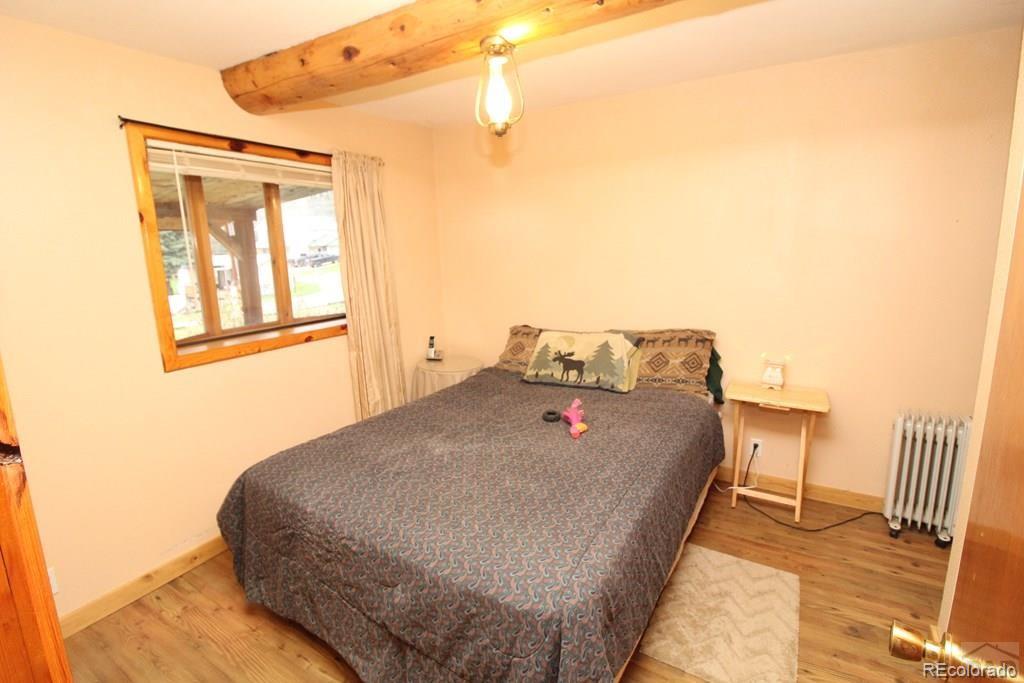148 County Road 378, Unit 378 Rye, CO 81069 - Photo 6 of 35 a bed sitting in a bedroom next to a window
