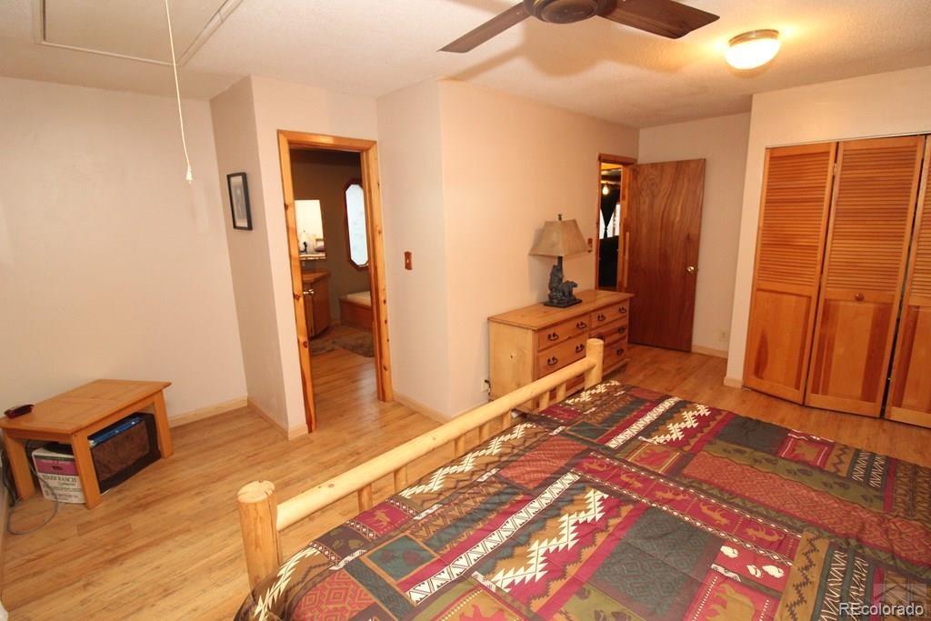 148 County Road 378, Unit 378 Rye, CO 81069 - Photo 10 of 35 a bedroom with a bed and a walk in closet