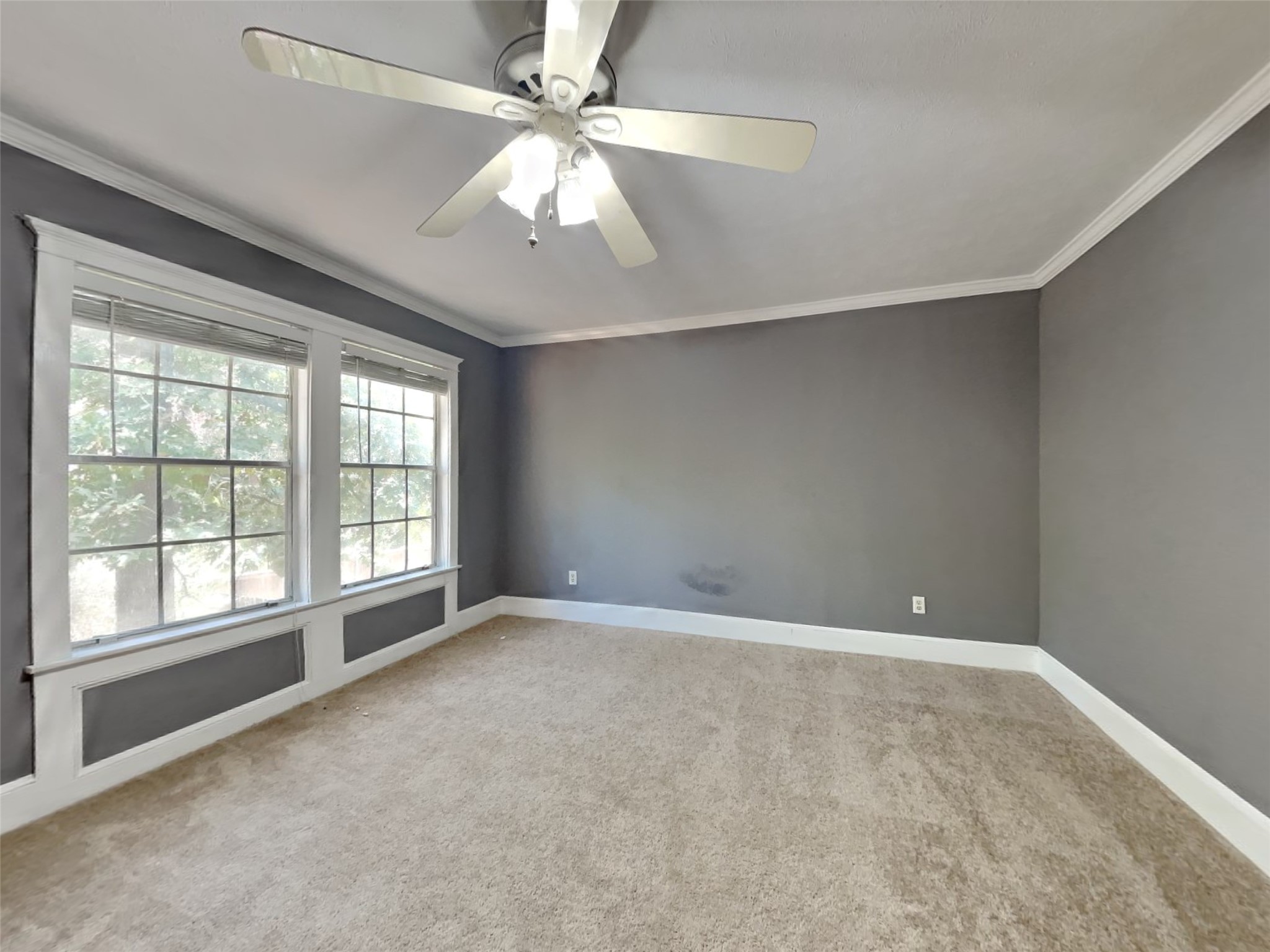 3910 Cedar Forest Drive Houston, TX 77339 - Photo 14 of 21 an empty room with chandelier fan and windows
