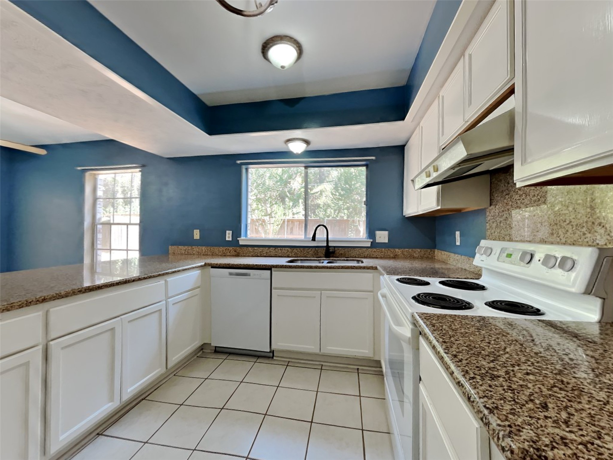 3910 Cedar Forest Drive Houston, TX 77339 - Photo 8 of 21 a kitchen with a stove sink and cabinets