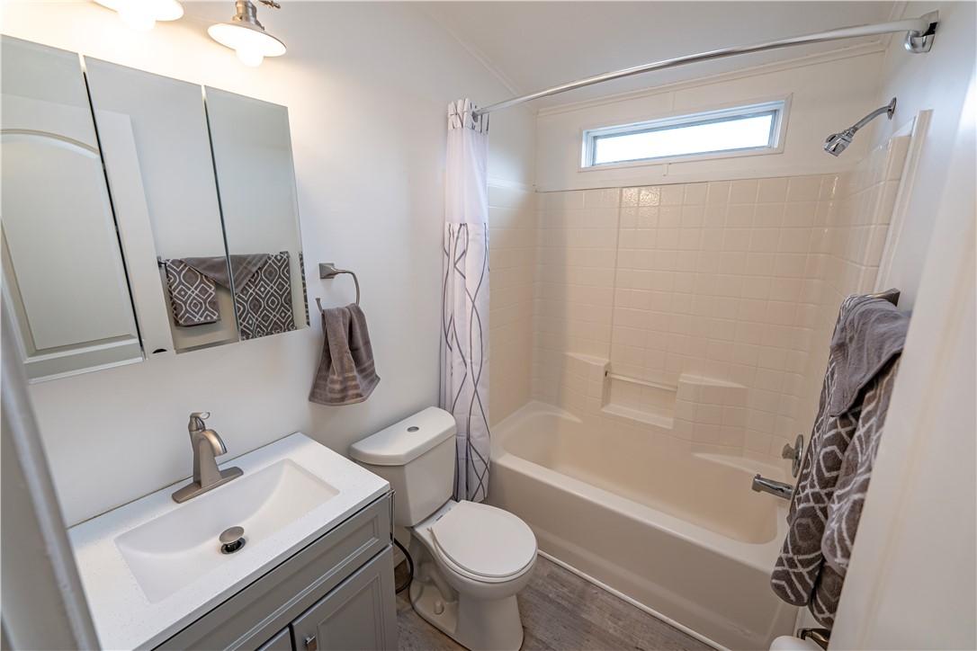 2765 North Silver Springs Road Kingman, AZ 86401 - Photo 26 of 60 a bathroom with a sink a toilet a mirror and shower