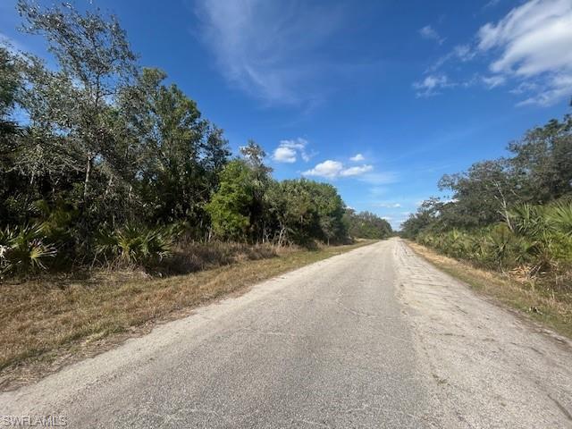 1 Kamain Road North Port, FL 34288 - Photo 4 of 4 a view of a road with a yard