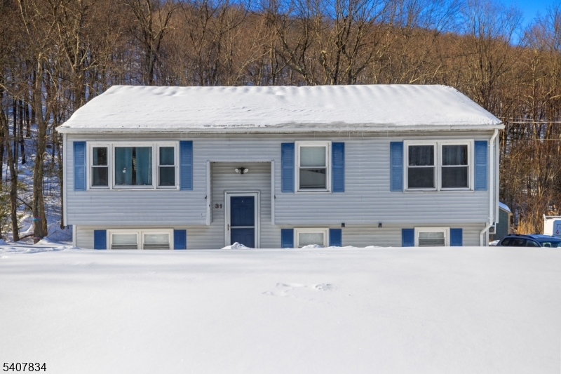 a view of building with large windows and outdoor space