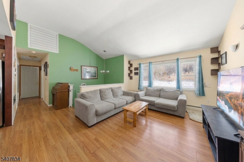 31 Meadow Lane Vernon, NJ 07462 - Photo 11 of 43 a living room with furniture and a large window