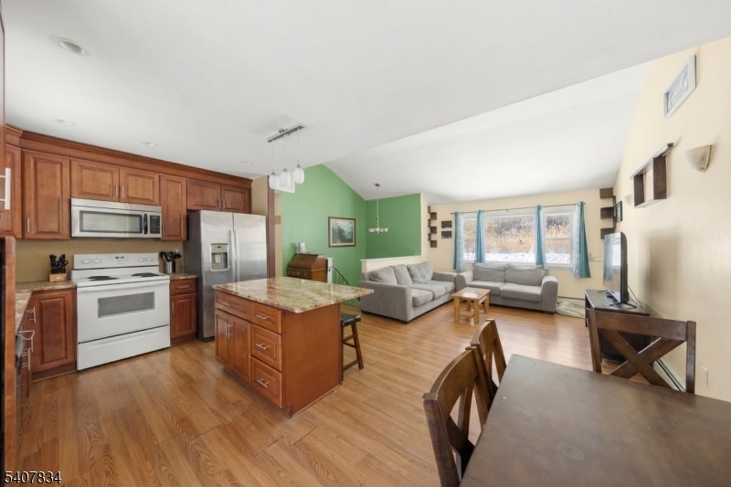 31 Meadow Lane Vernon, NJ 07462 - Photo 12 of 43 a living room with furniture and a flat screen tv