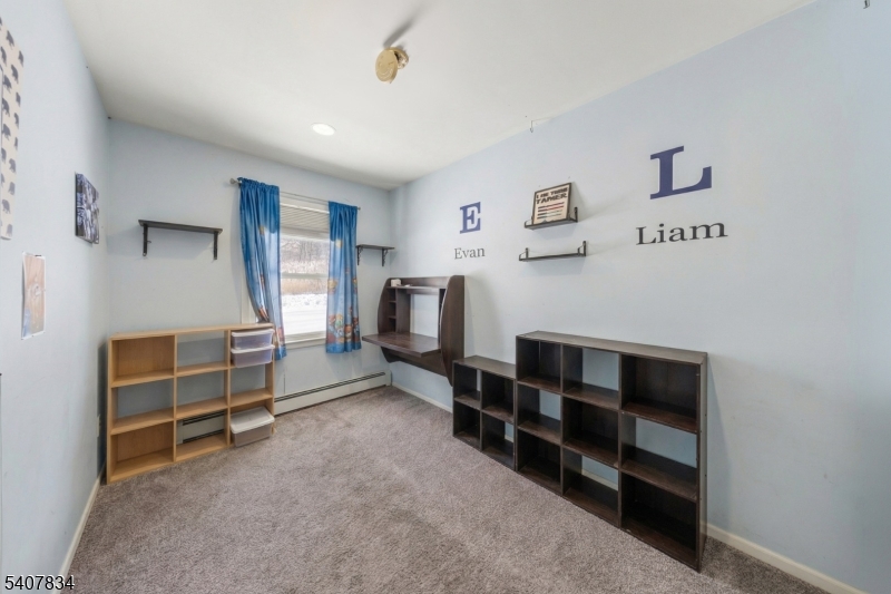 31 Meadow Lane Vernon, NJ 07462 - Photo 20 of 43 a view of an empty room with window and cabinet