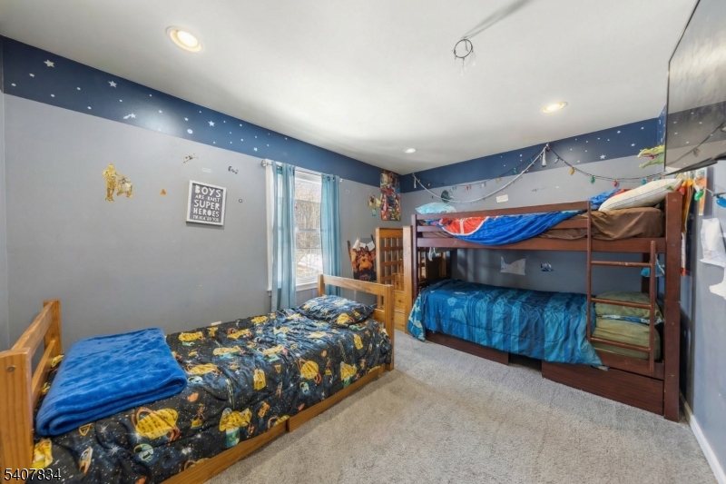 31 Meadow Lane Vernon, NJ 07462 - Photo 21 of 43 a bedroom with a bed and a walk in closet