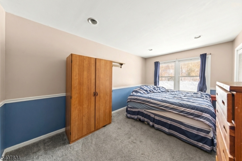31 Meadow Lane Vernon, NJ 07462 - Photo 22 of 43 a bedroom with a bed and a window