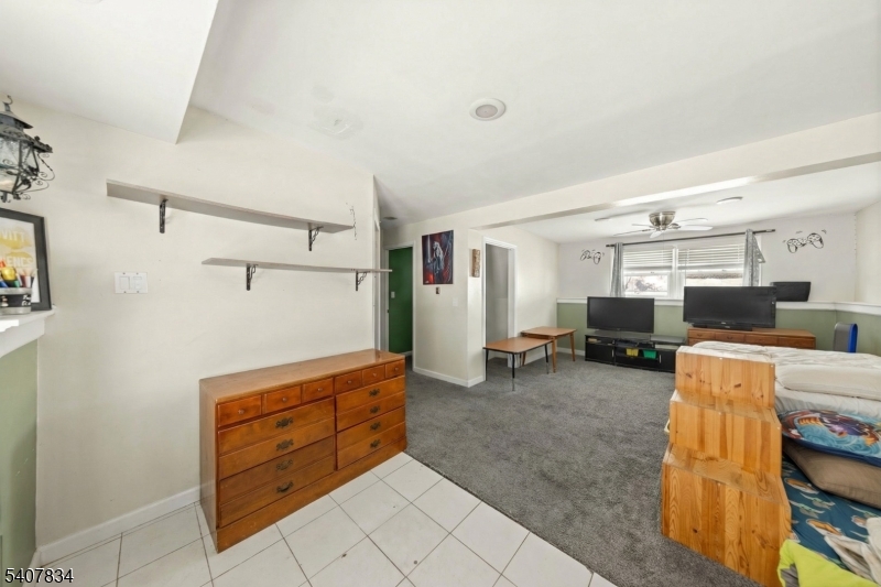31 Meadow Lane Vernon, NJ 07462 - Photo 25 of 43 a living room with furniture and a flat screen tv