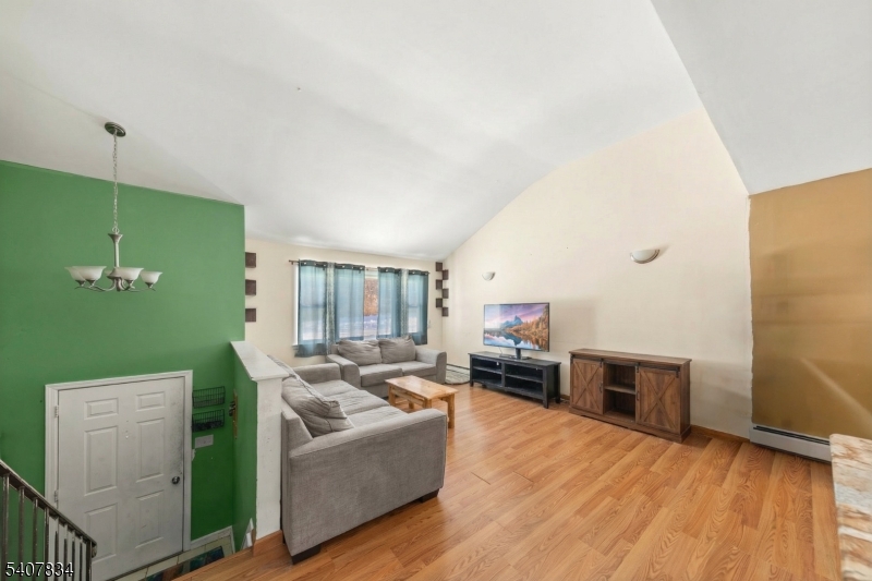 31 Meadow Lane Vernon, NJ 07462 - Photo 10 of 43 a living room with furniture and a wooden floor