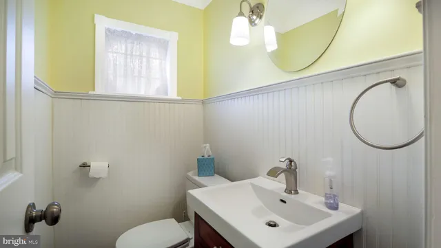 a bedroom with a bed and a flat screen television