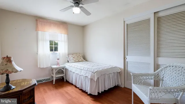 a bathroom with a sink toilet a mirror and shower