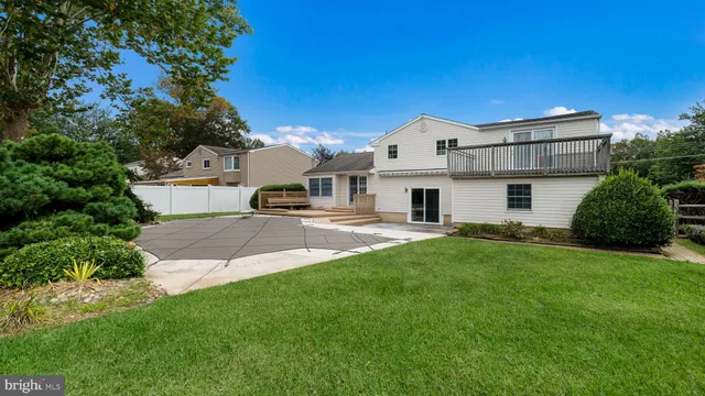 a view of house with backyard