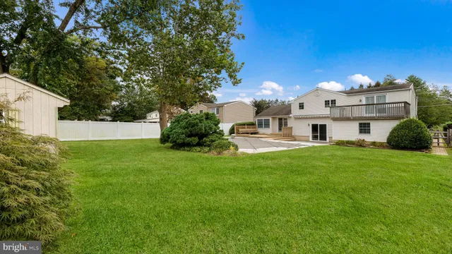 a view of a backyard with a small cabin