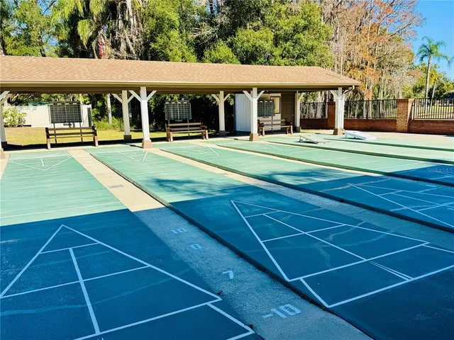 a view of a swimming pool with a yard
