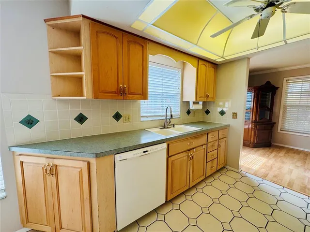 a kitchen with a sink and cabinets