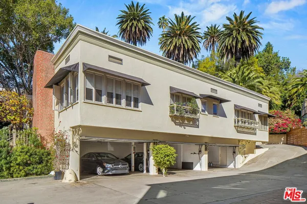 a front view of a house with a garage