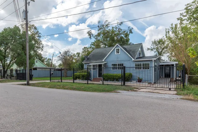 a view of a house next to a yard