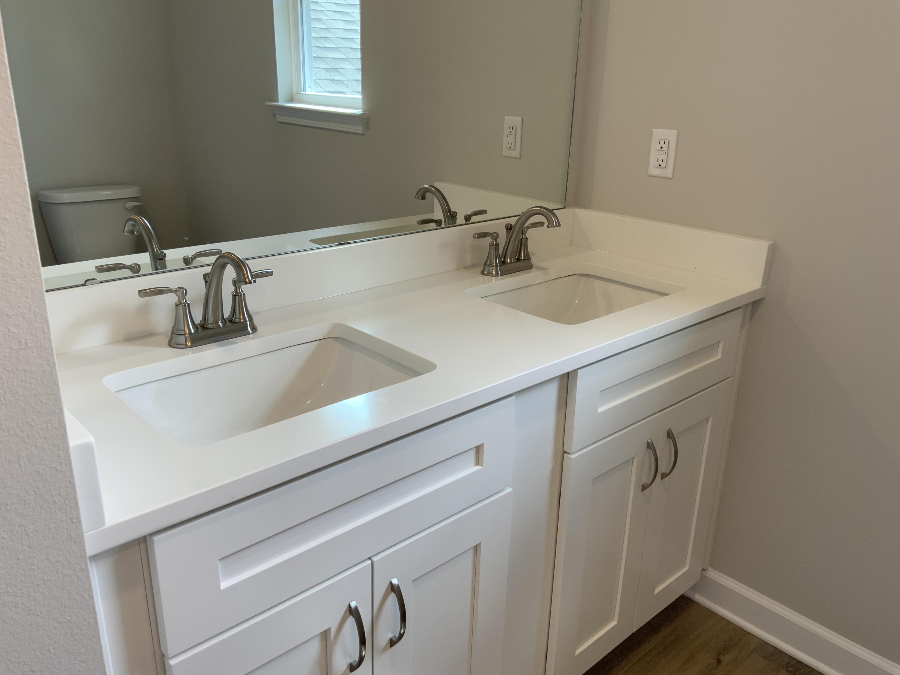 32 Laurel Oaks Drive Freeport, FL 32439 - Photo 6 of 11 a bathroom with a sink and a mirror