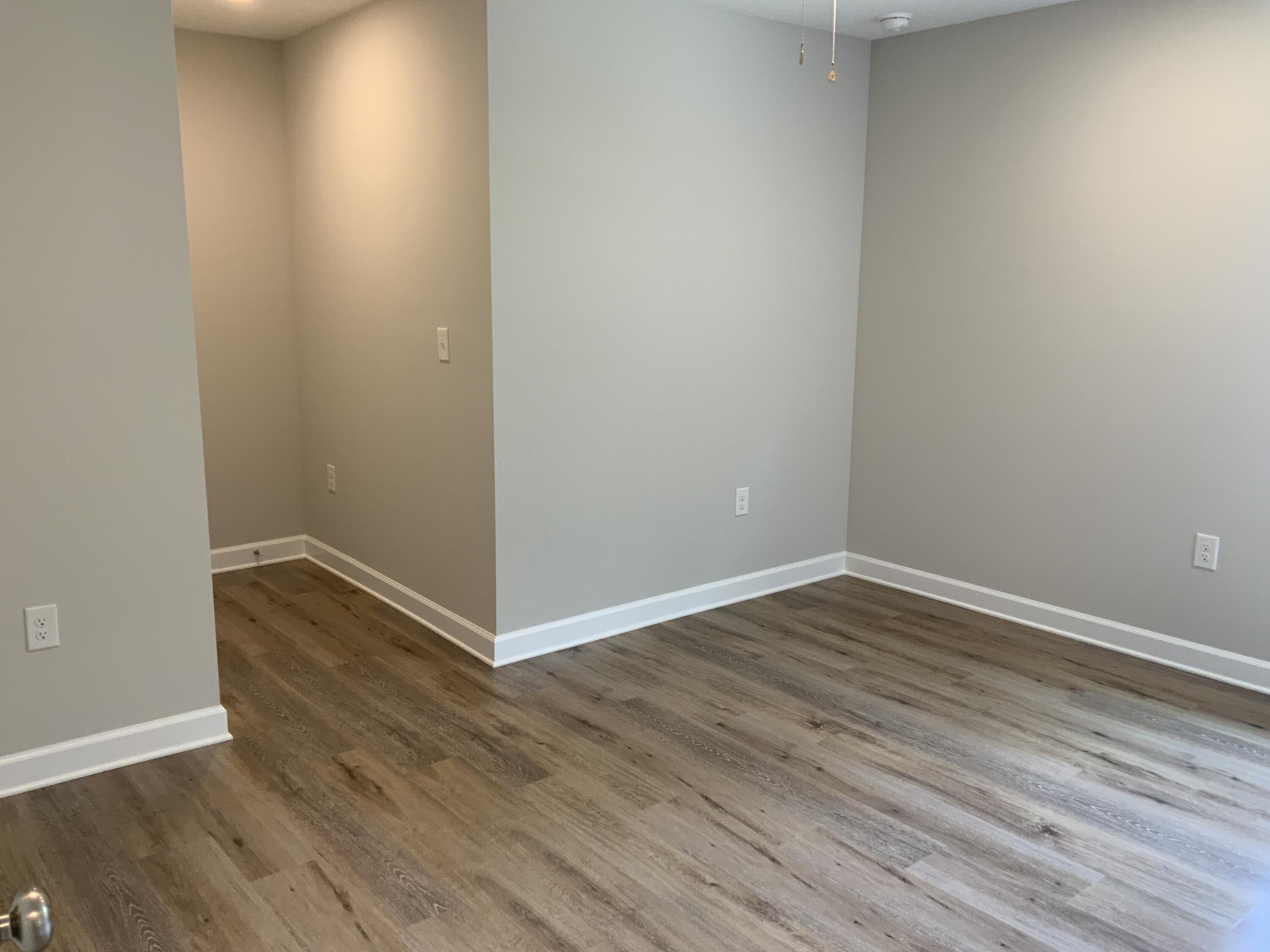 32 Laurel Oaks Drive Freeport, FL 32439 - Photo 10 of 11 a view of an empty room with wooden floor
