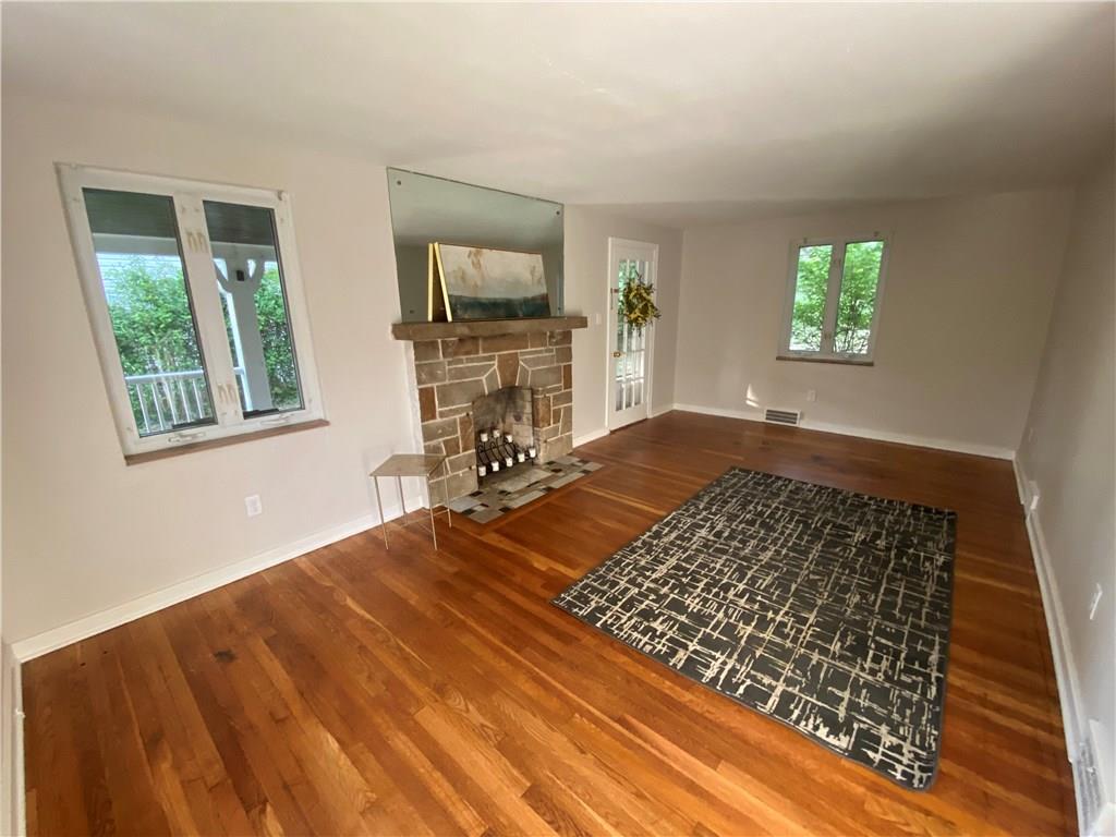 615 Kelso Road Pittsburgh, PA 15243 - Photo 3 of 25 living room from a different angle....mirror is attached to wall but could be removed for a placement of a televisionn
