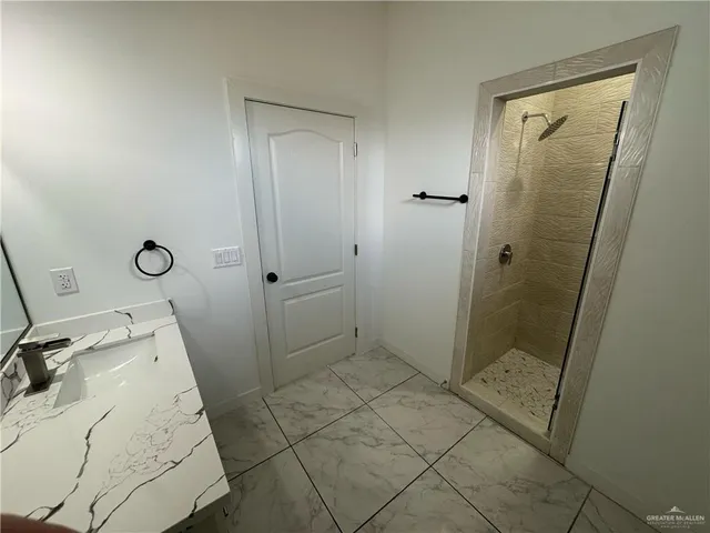 a bathroom with a tub and shower