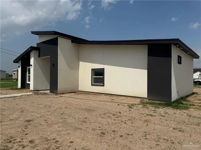 a house with trees in the background