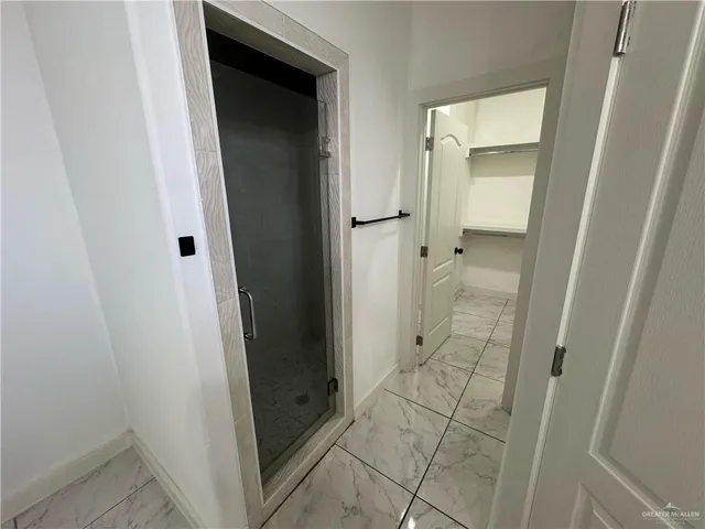 an entrance view of a bathroom from a hallway