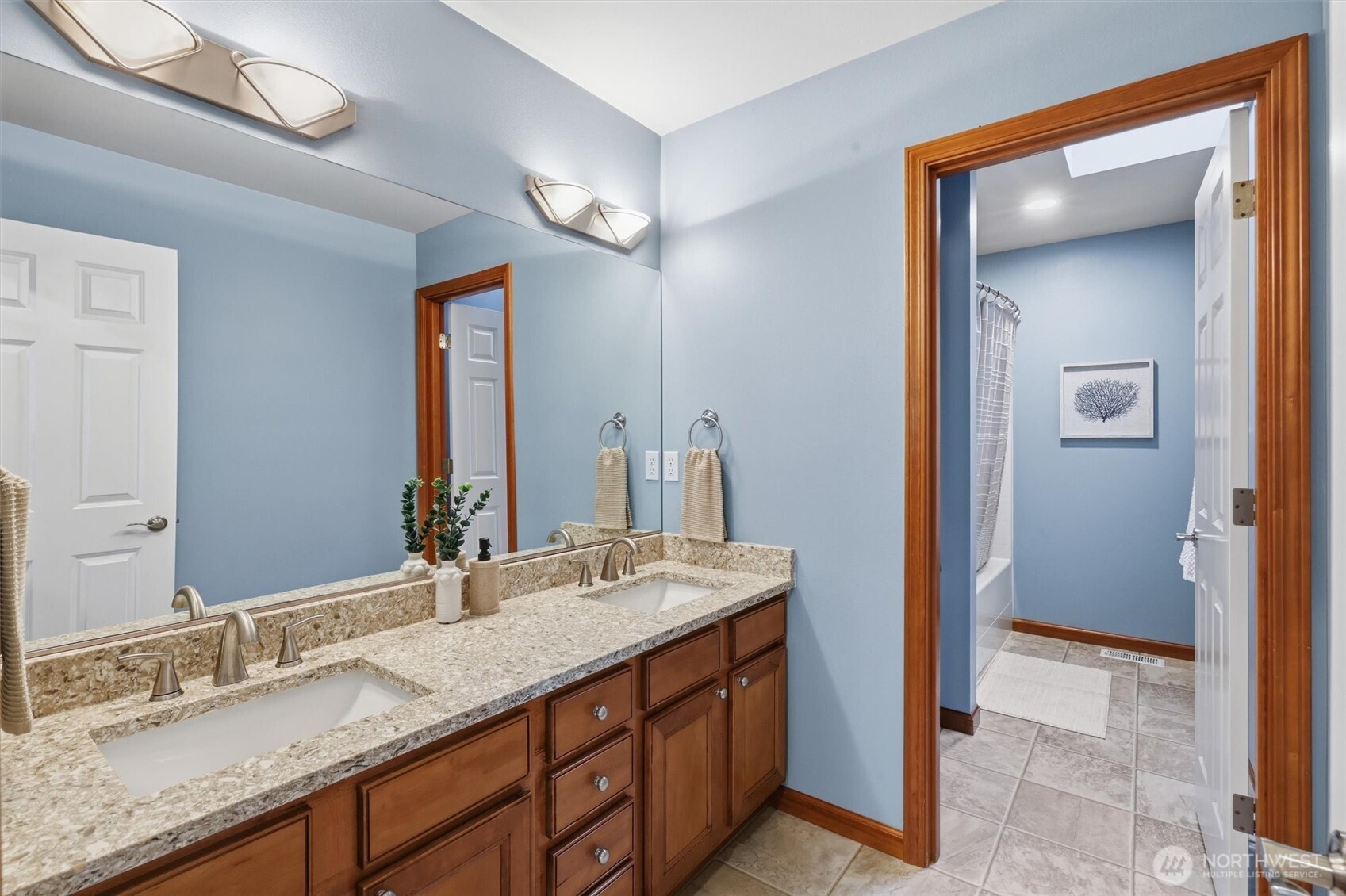 4202 Silvana Terrace Road Stanwood, WA 98292 - Photo 28 of 40 a bathroom with a granite countertop sink and a mirror