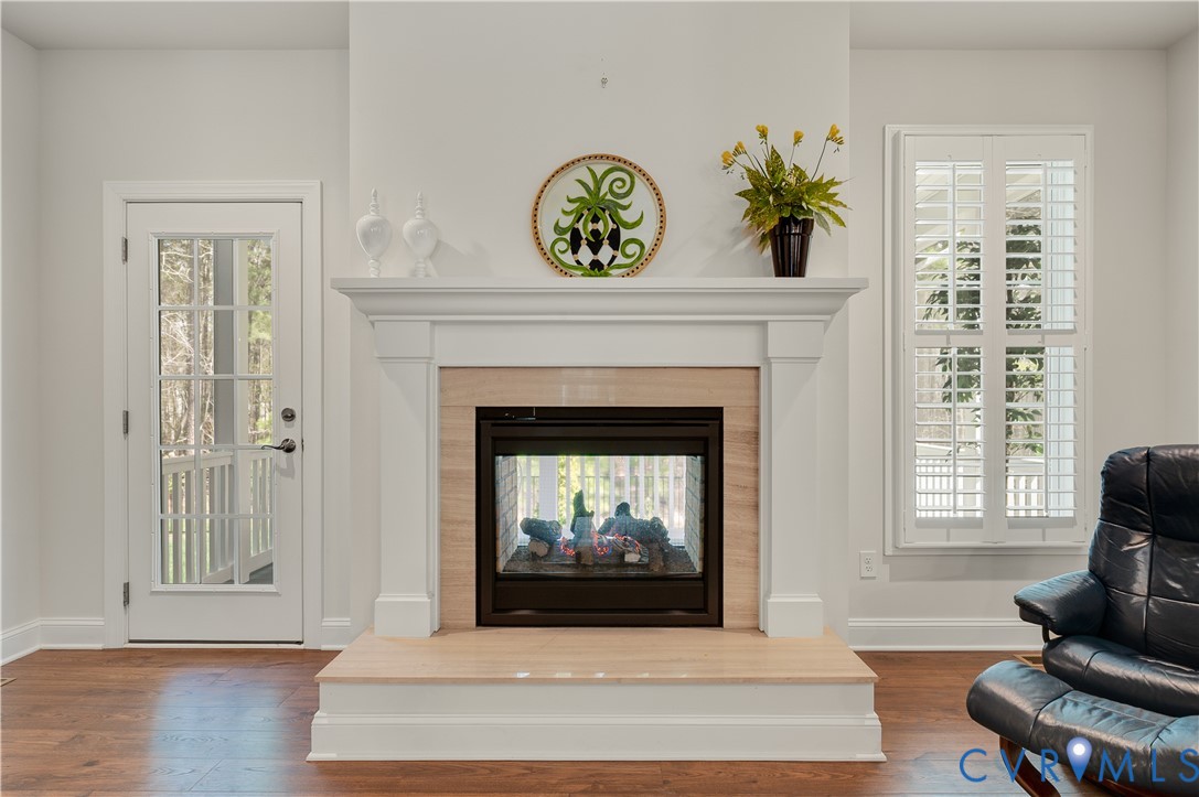 9419 Widthby Road Chesterfield, VA 23832 - Photo 24 of 40 Stylish twilight double-sided fireplace