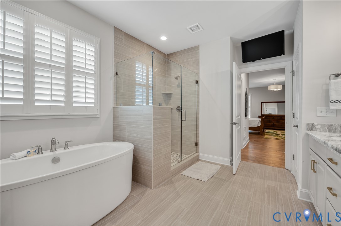 9419 Widthby Road Chesterfield, VA 23832 - Photo 29 of 40 Ensuite bathroom with free-standing soaker tub, sh