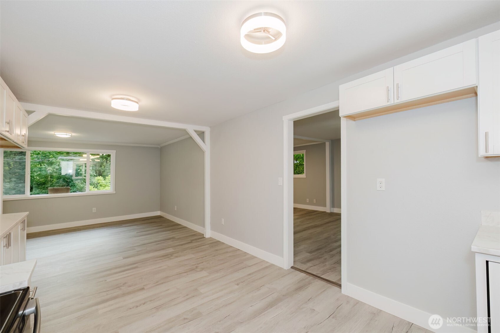 80 East Judy Lane Belfair, WA 98528 - Photo 20 of 40 an empty room with wooden floor and windows