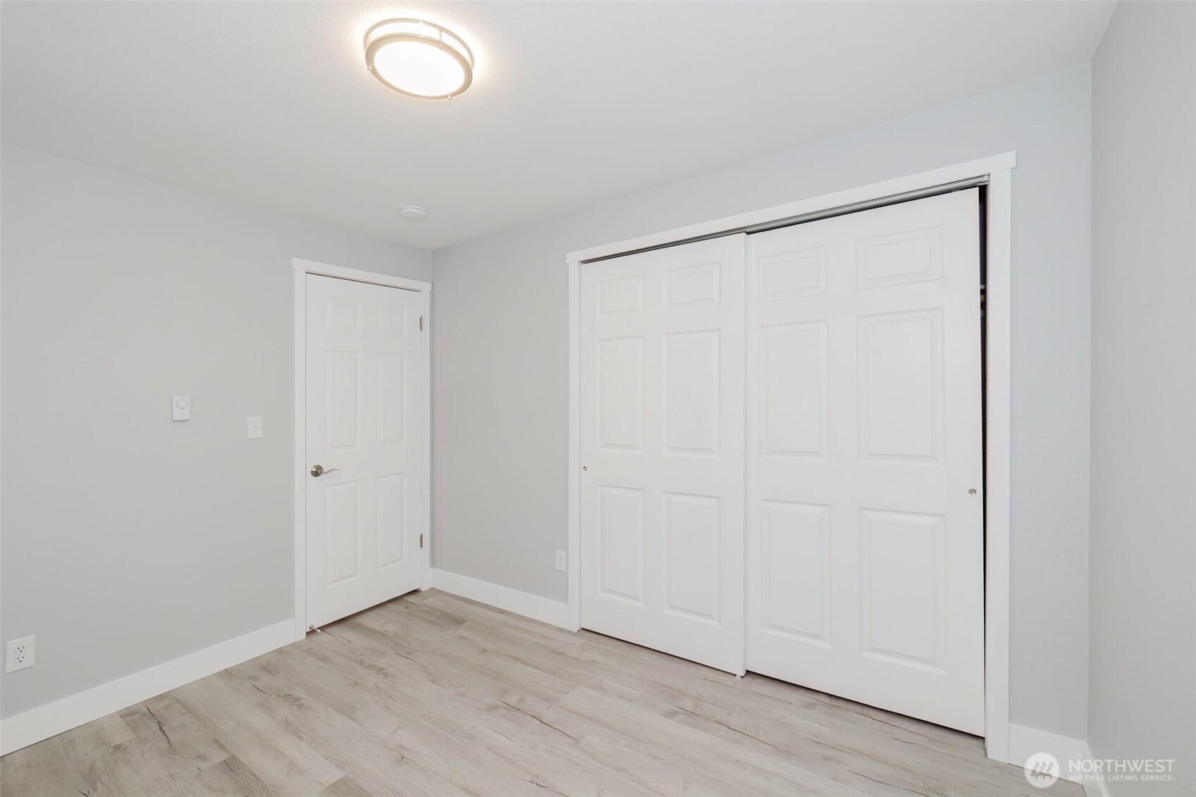 80 East Judy Lane Belfair, WA 98528 - Photo 22 of 40 an empty room with wooden floor and closet
