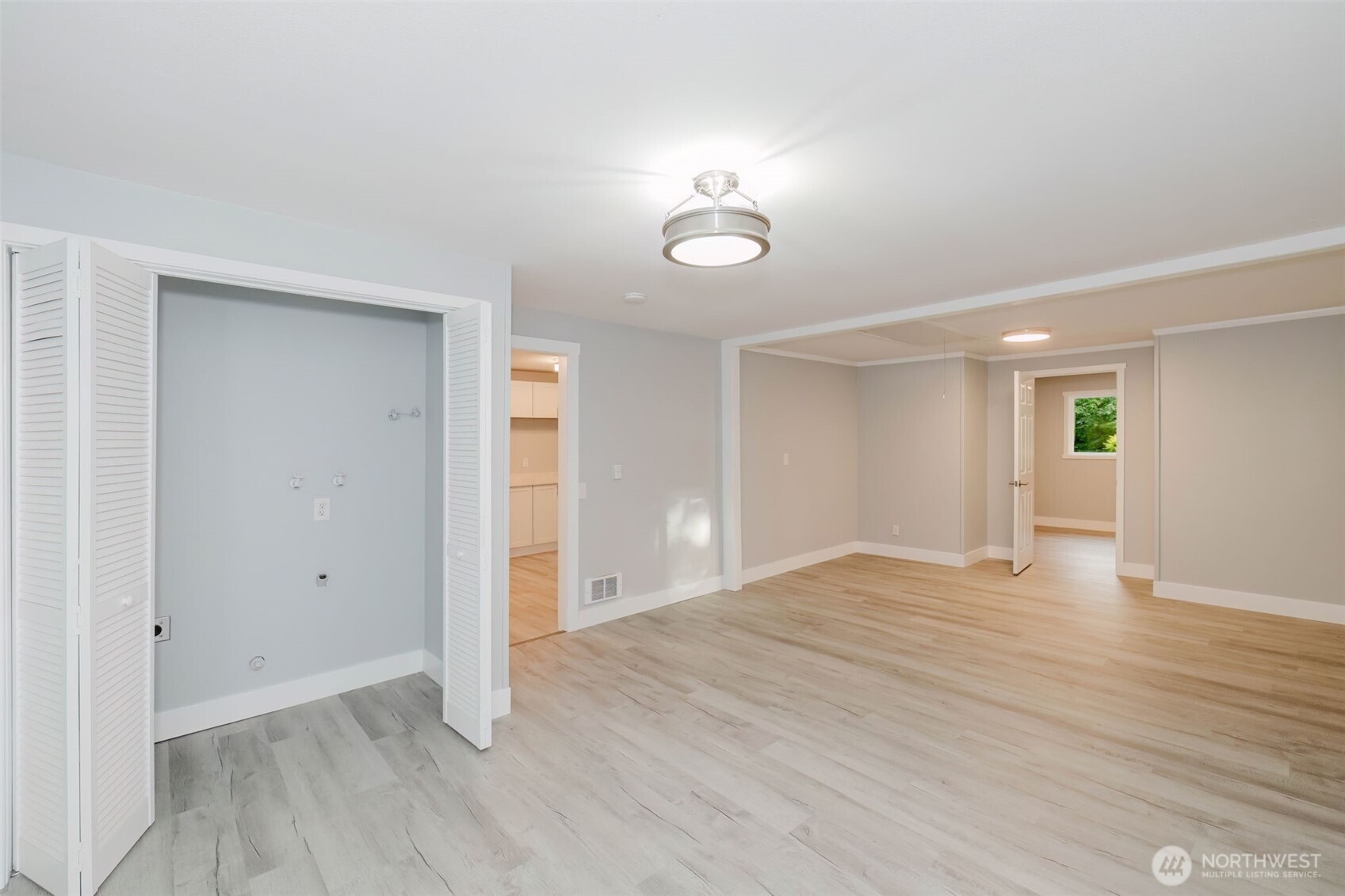 80 East Judy Lane Belfair, WA 98528 - Photo 31 of 40 wooden floor in an empty room with a window