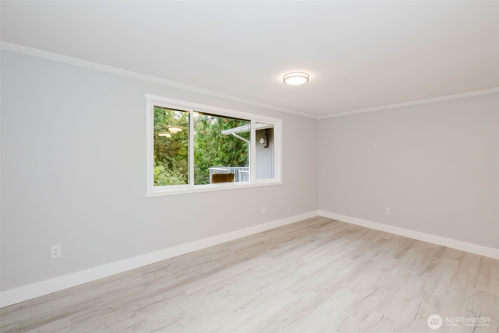 80 East Judy Lane Belfair, WA 98528 - Photo 35 of 40 an empty room with wooden floor and windows