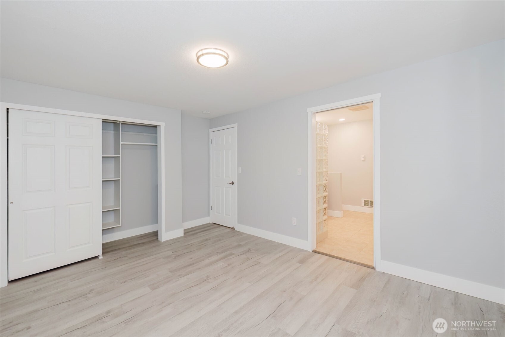 80 East Judy Lane Belfair, WA 98528 - Photo 37 of 40 a view of an empty room with wooden floor and closet