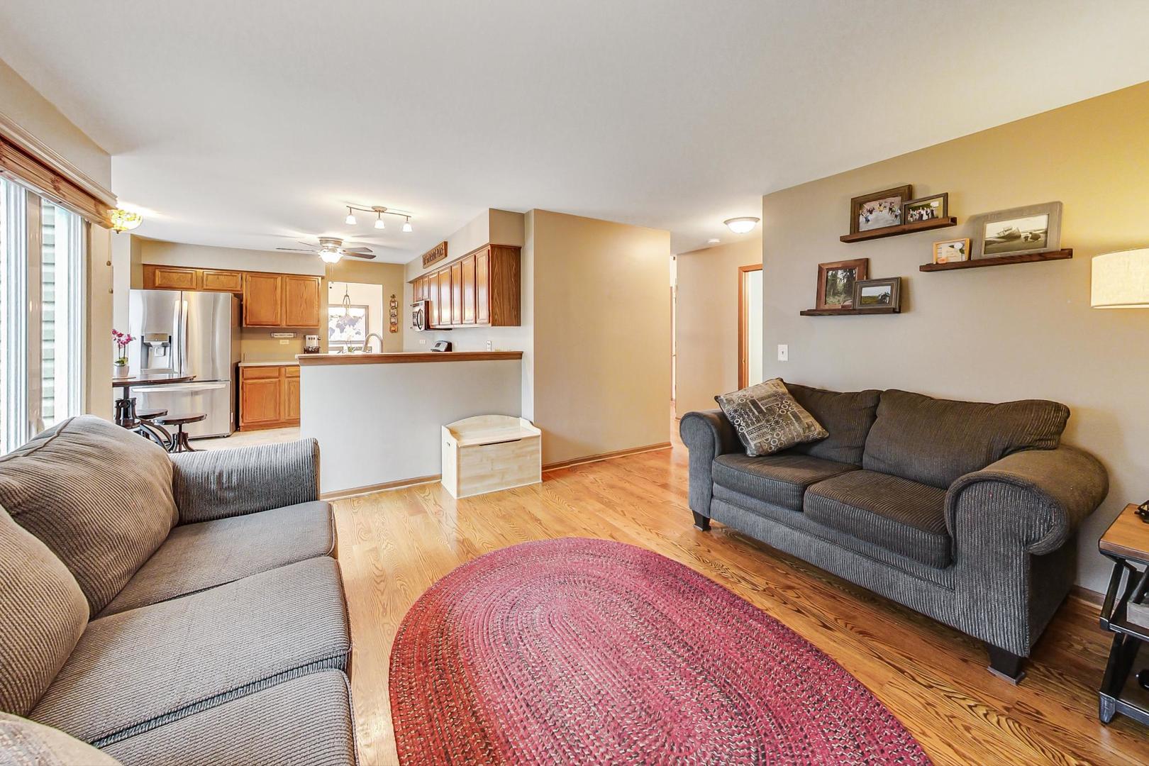 1174 Sweetwater Ridge Lake In The Hills, IL 60156 - Photo 14 of 44 a living room with furniture and a couch