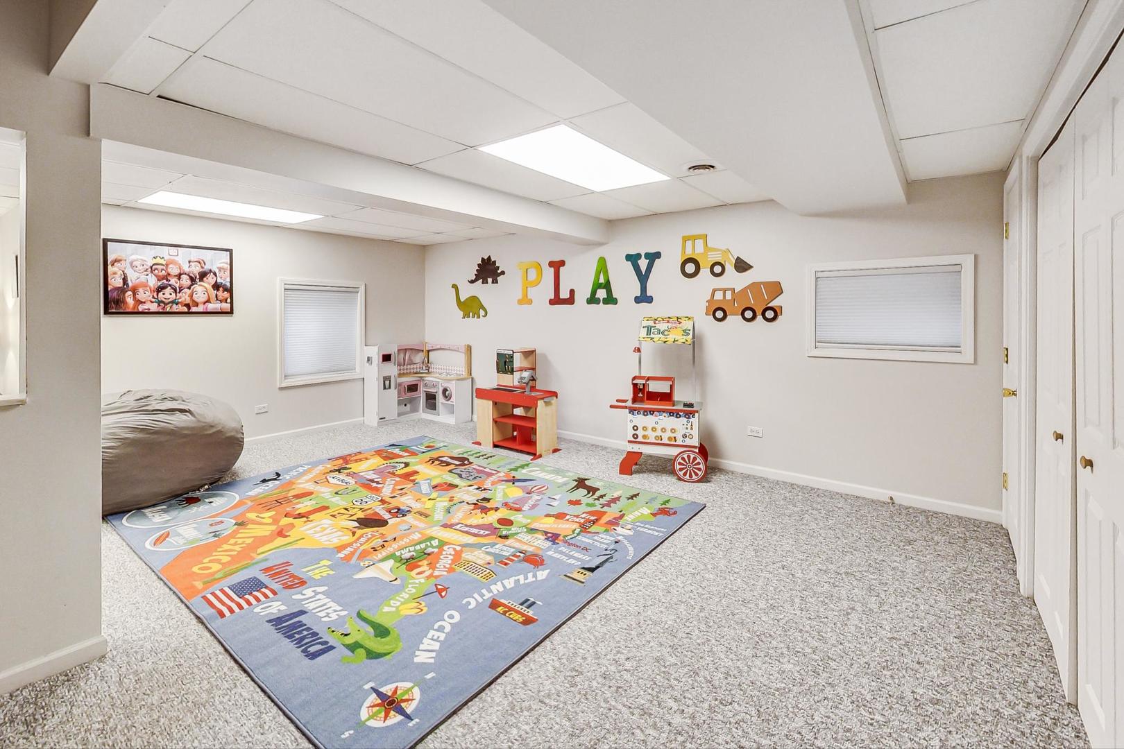 1174 Sweetwater Ridge Lake In The Hills, IL 60156 - Photo 28 of 44 a bedroom that has a bed and a table in it