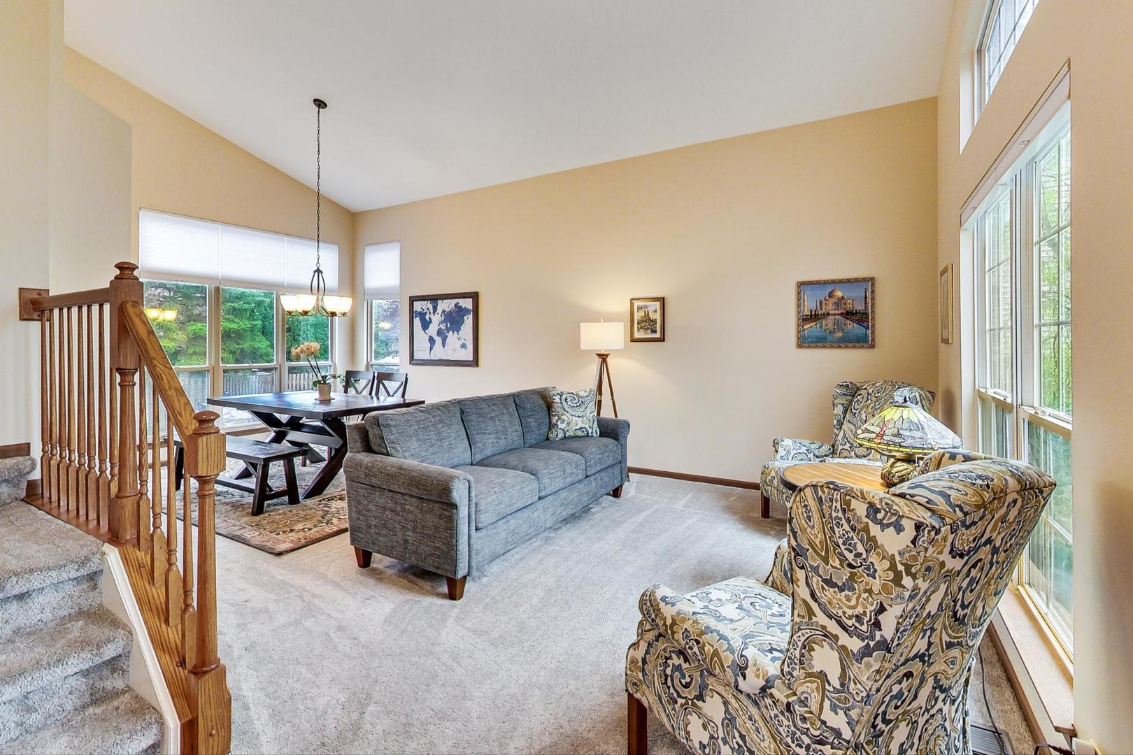 1174 Sweetwater Ridge Lake In The Hills, IL 60156 - Photo 3 of 44 a living room with furniture and a large window