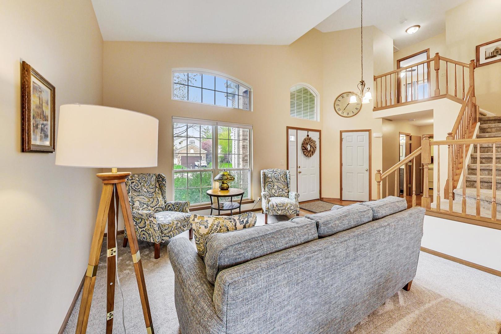 1174 Sweetwater Ridge Lake In The Hills, IL 60156 - Photo 5 of 44 a living room with furniture and a table