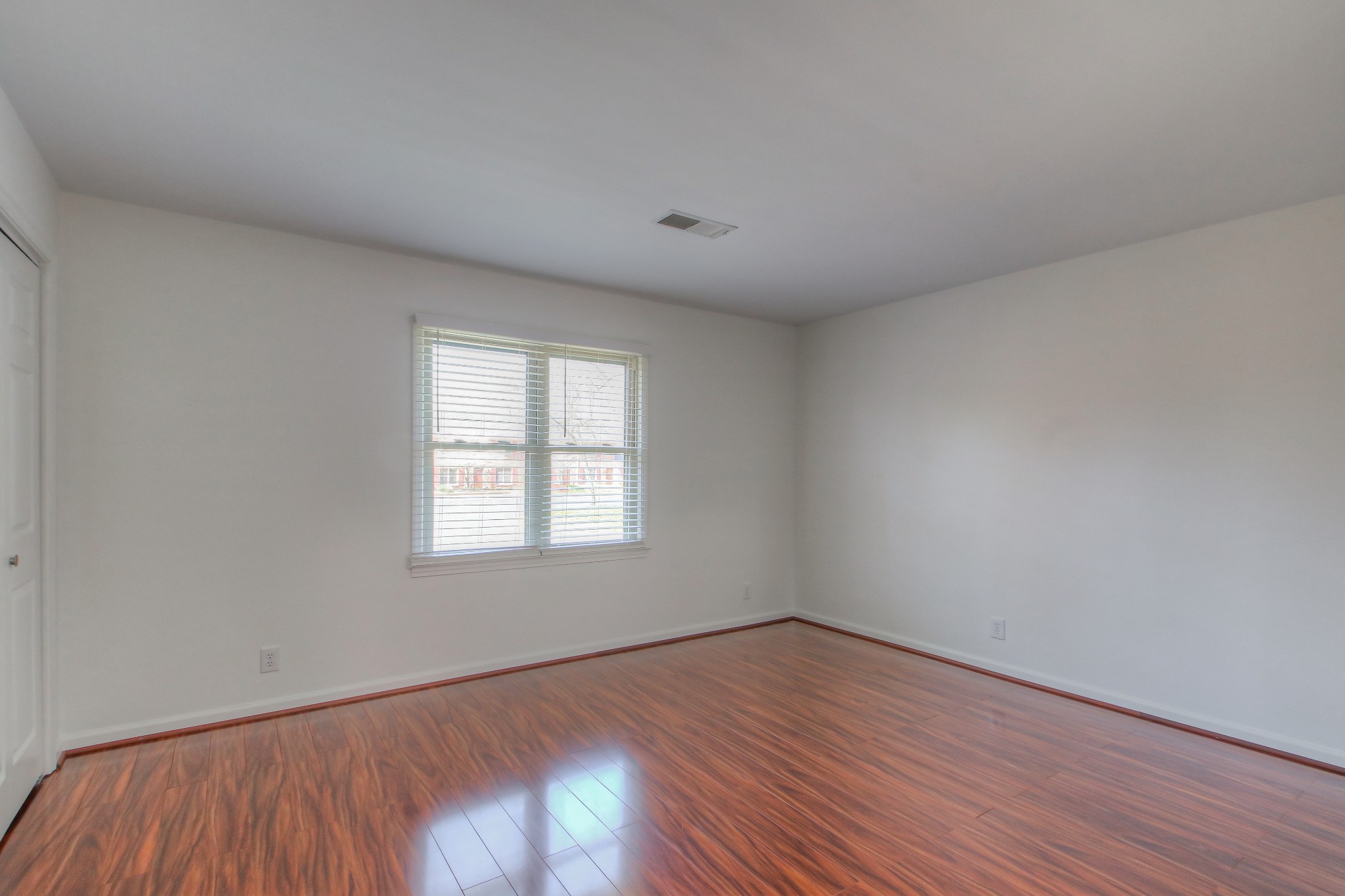 771 Kent Road Nashville, TN 37214 - Photo 27 of 34 an empty room with wooden floor and windows