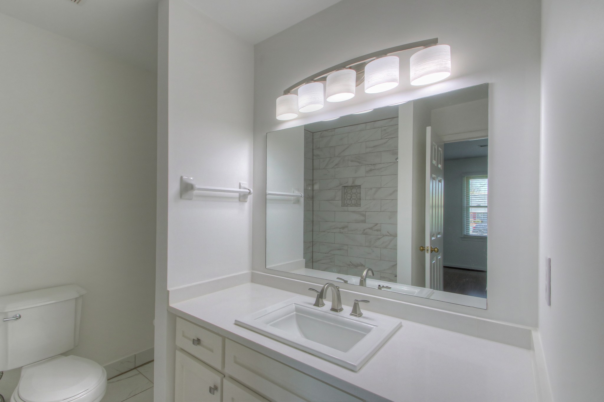 771 Kent Road Nashville, TN 37214 - Photo 30 of 34 a bathroom with a sink a toilet and a mirror