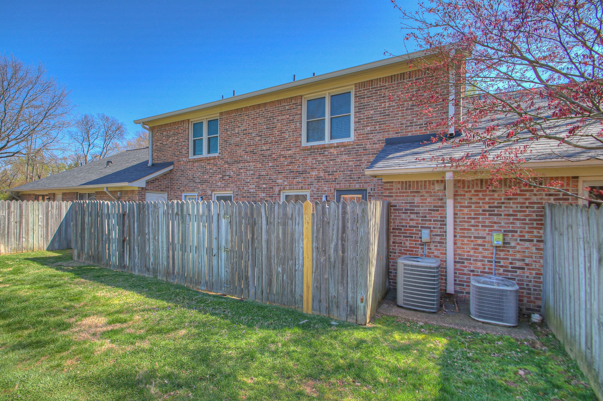 771 Kent Road Nashville, TN 37214 - Photo 9 of 34 a view of a backyard with brick wall and a large tree