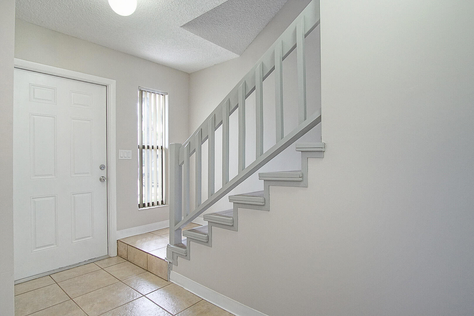 4206 Inlet Circle Greenacres, FL 33463 - Photo 2 of 30 a view of entryway with stairs