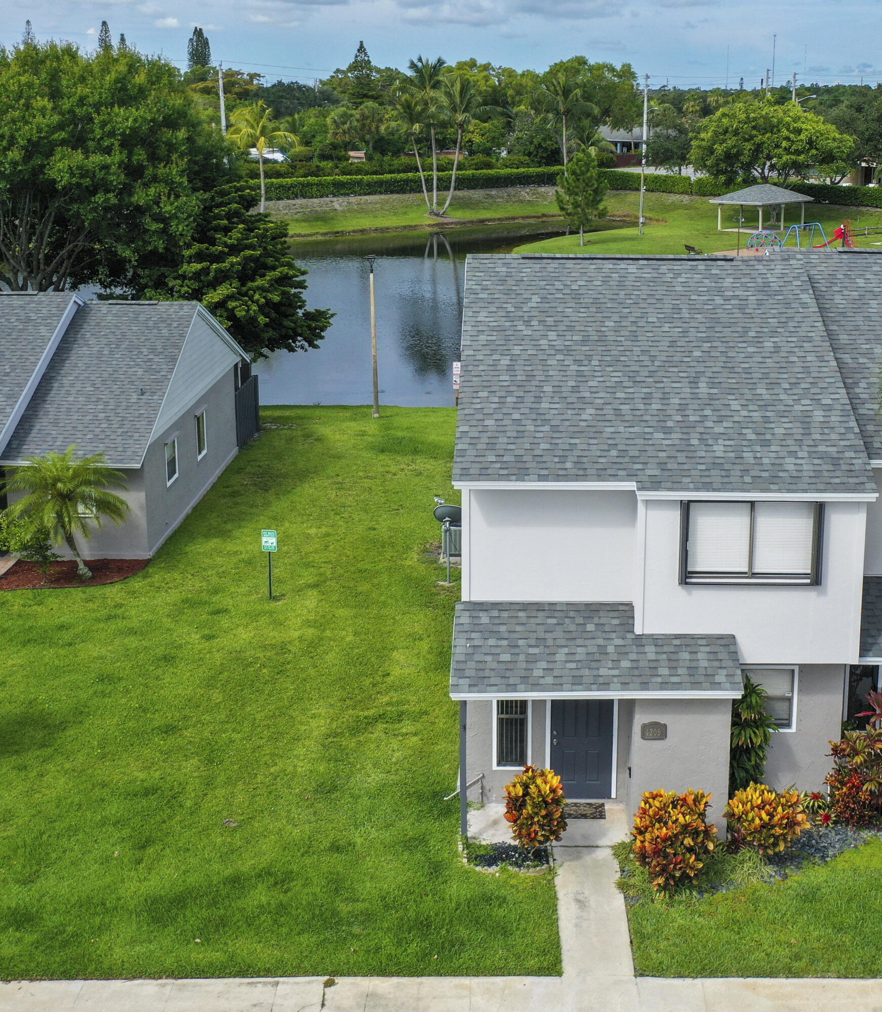 4206 Inlet Circle Greenacres, FL 33463 - Photo 24 of 30 a aerial view of a house with a yard