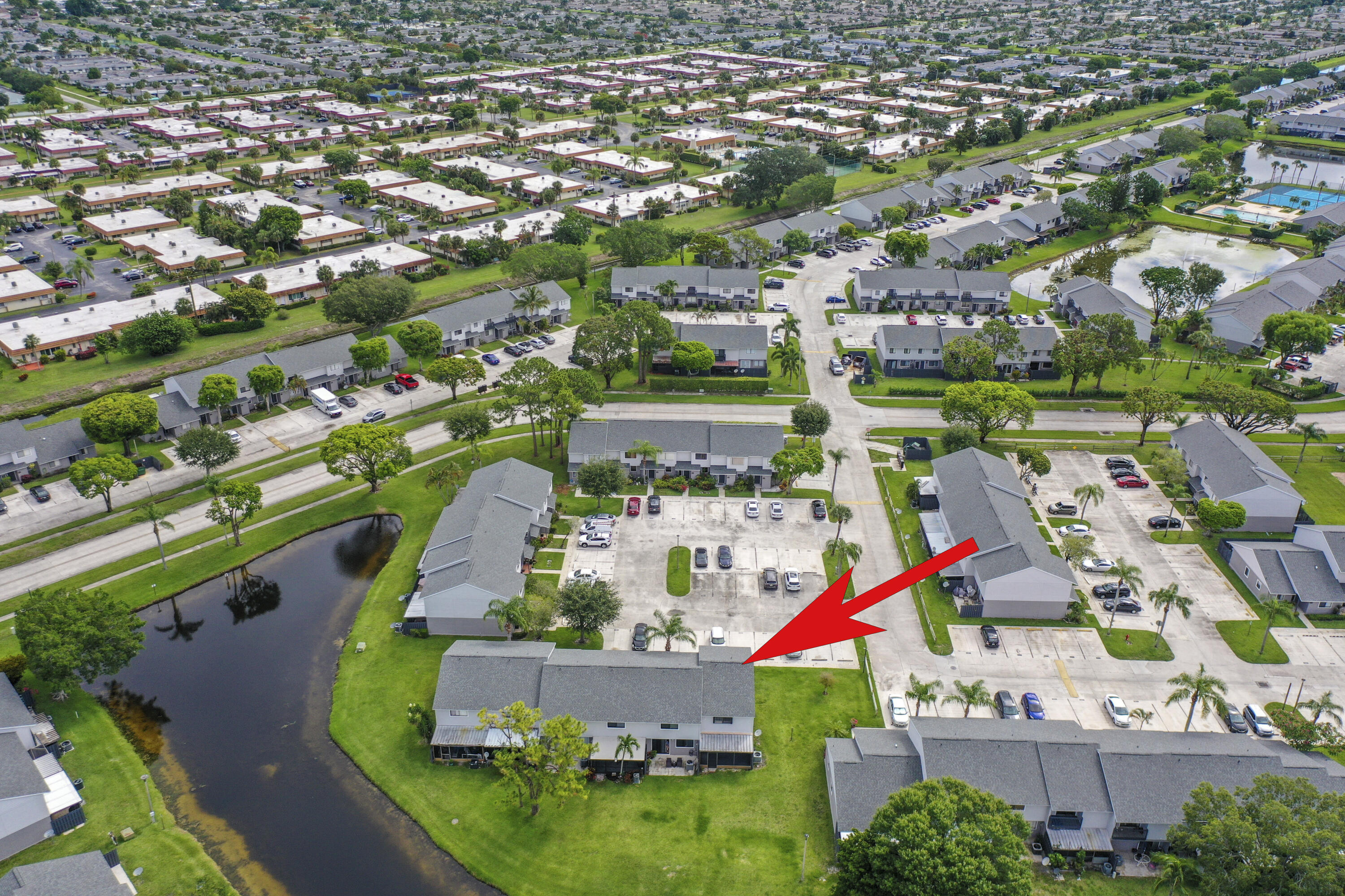 4206 Inlet Circle Greenacres, FL 33463 - Photo 26 of 30 an aerial view of residential houses with outdoor space and parking