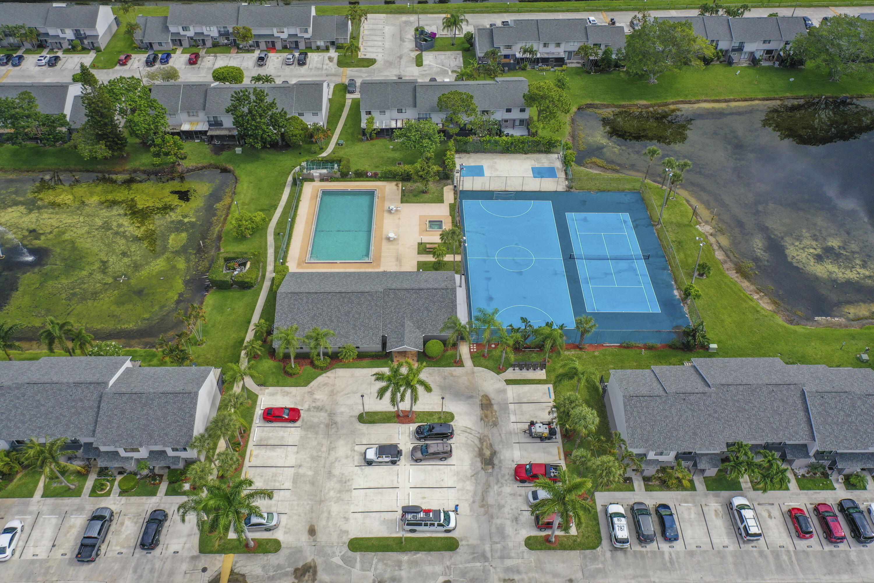 4206 Inlet Circle Greenacres, FL 33463 - Photo 27 of 30 an aerial view of multiple houses with yard