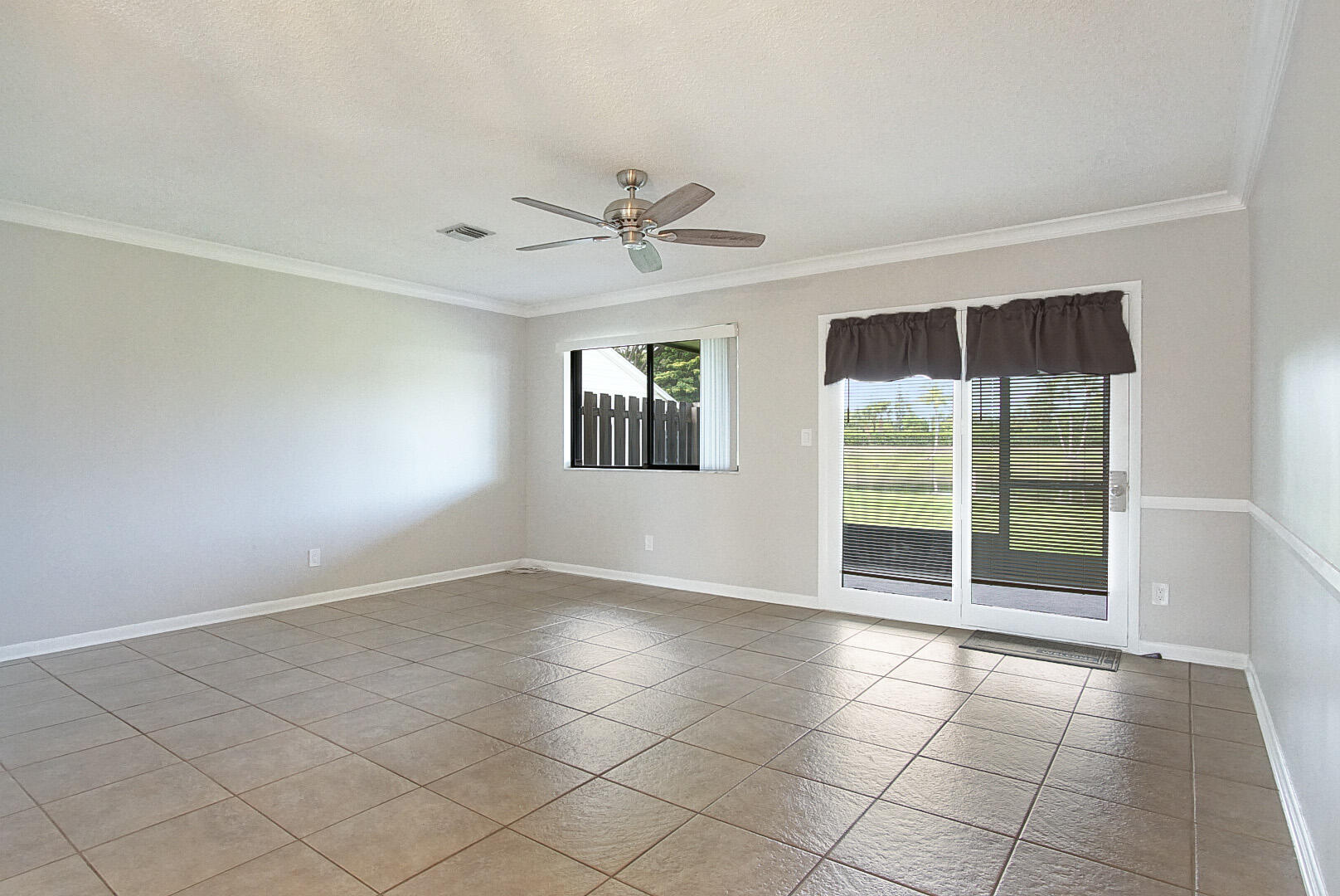 4206 Inlet Circle Greenacres, FL 33463 - Photo 3 of 30 a view of an empty room with a window